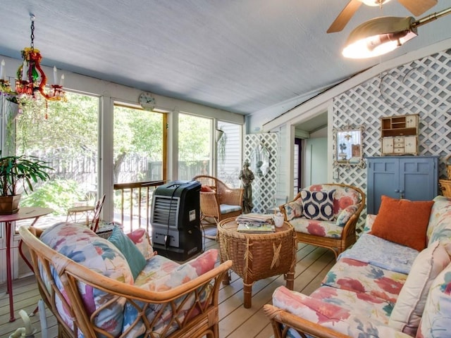 sunroom / solarium with a ceiling fan