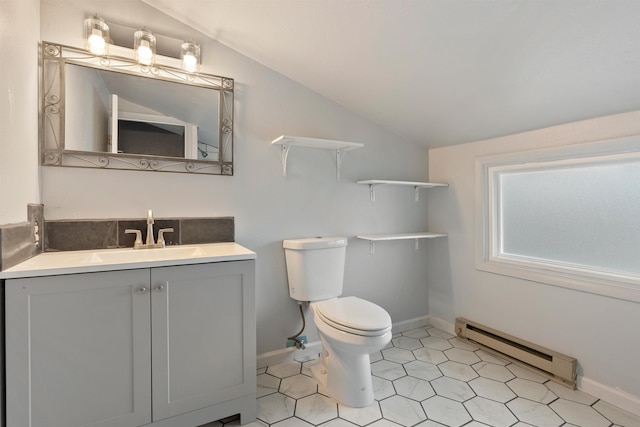 bathroom with toilet, a baseboard heating unit, tile patterned flooring, vanity, and vaulted ceiling