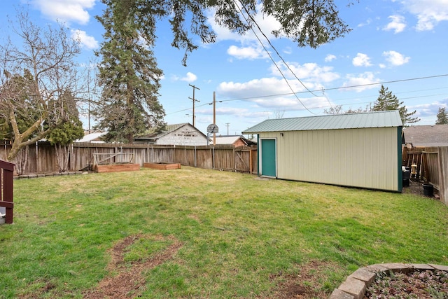 view of yard featuring a storage unit, an outdoor structure, and a fenced backyard