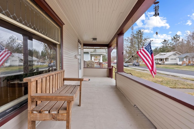 view of patio featuring a residential view and a porch