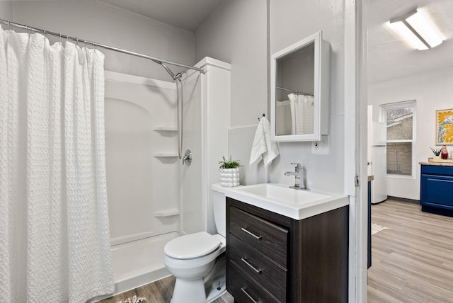 full bathroom with a shower with curtain, wood finished floors, and vanity