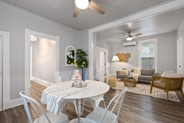 dining space with wood finished floors, a ceiling fan, and a wall mounted AC