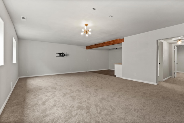 empty room featuring visible vents, baseboards, and carpet floors