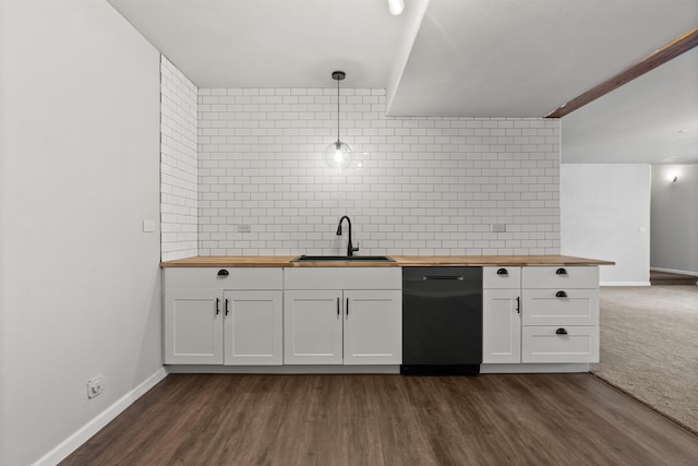 kitchen featuring decorative backsplash, butcher block counters, dishwasher, and a sink