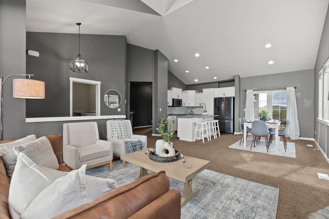 living room with recessed lighting, carpet, baseboards, and high vaulted ceiling