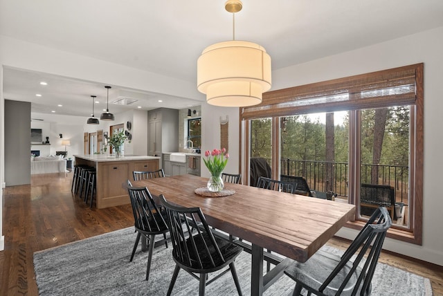 dining room featuring recessed lighting, baseboards, and dark wood-style flooring