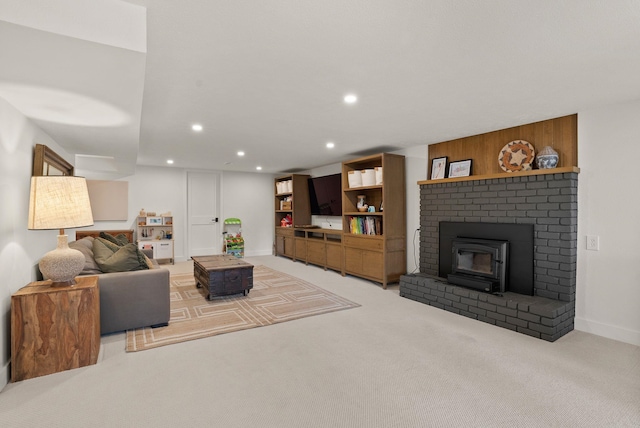 living room with recessed lighting, baseboards, and light carpet