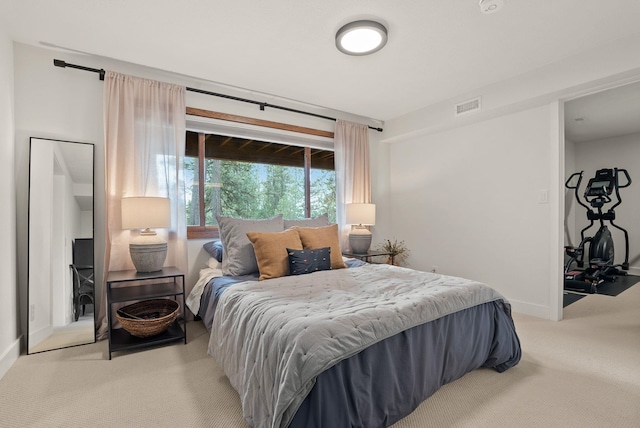 bedroom featuring visible vents, carpet flooring, and baseboards