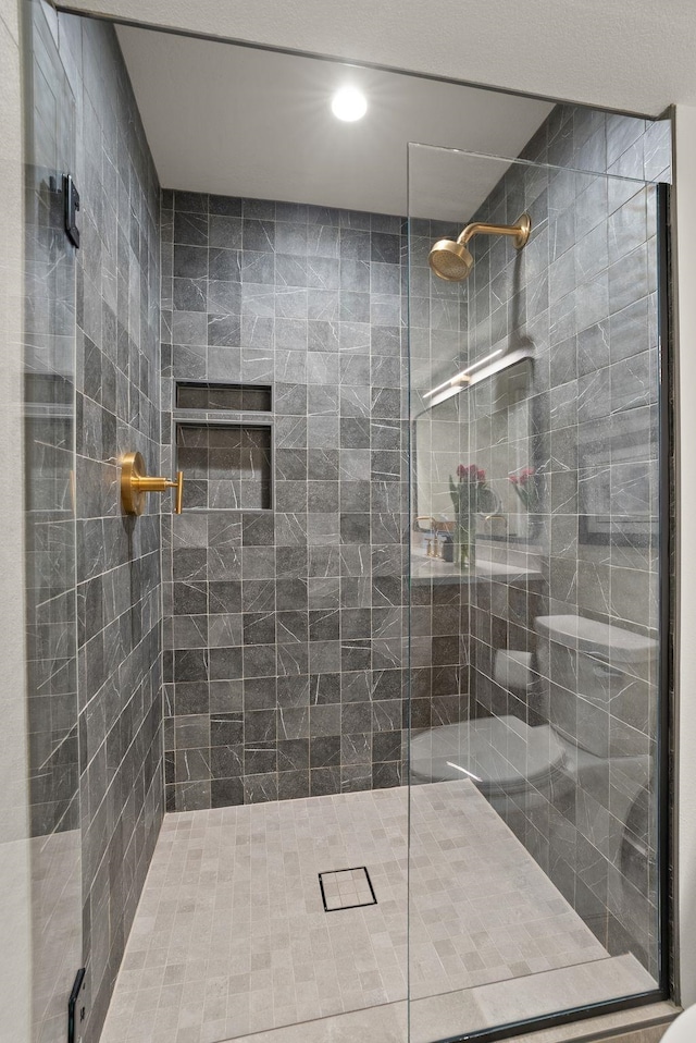 bathroom with a shower stall