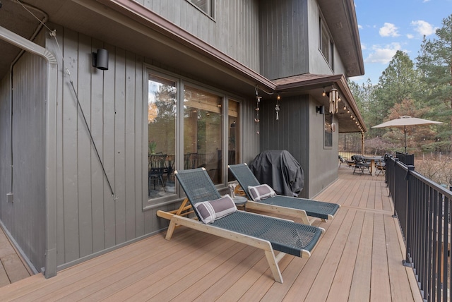 wooden deck with outdoor dining space