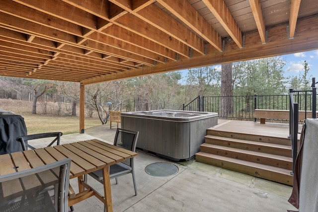 view of patio / terrace with outdoor dining space and a hot tub