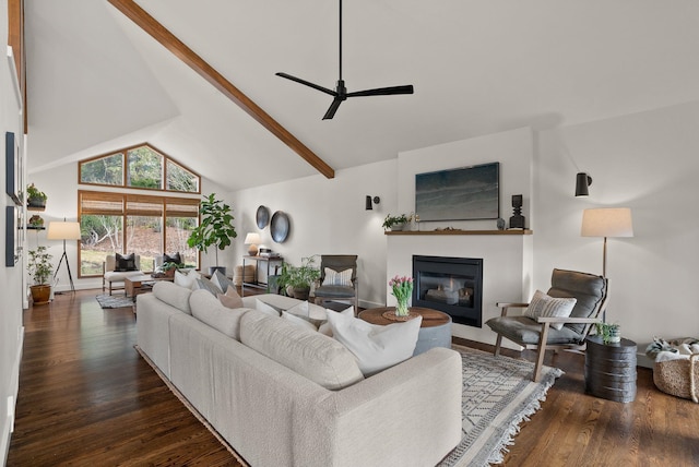 living area featuring a glass covered fireplace, high vaulted ceiling, wood finished floors, and ceiling fan