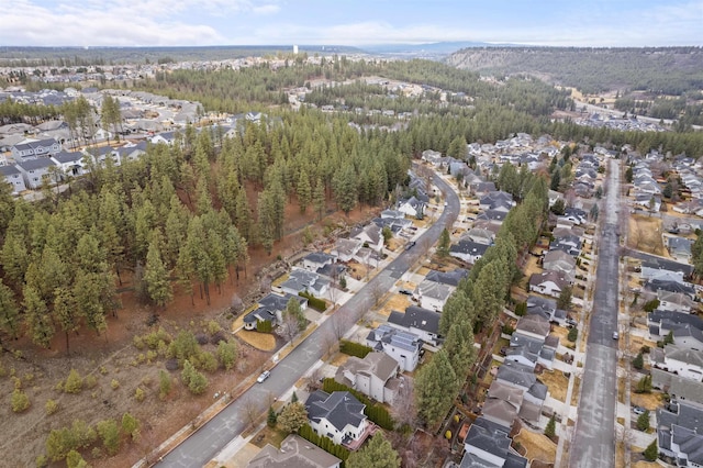 bird's eye view featuring a residential view and a forest view