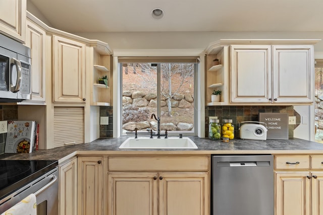 kitchen with a sink, open shelves, dark countertops, appliances with stainless steel finishes, and decorative backsplash