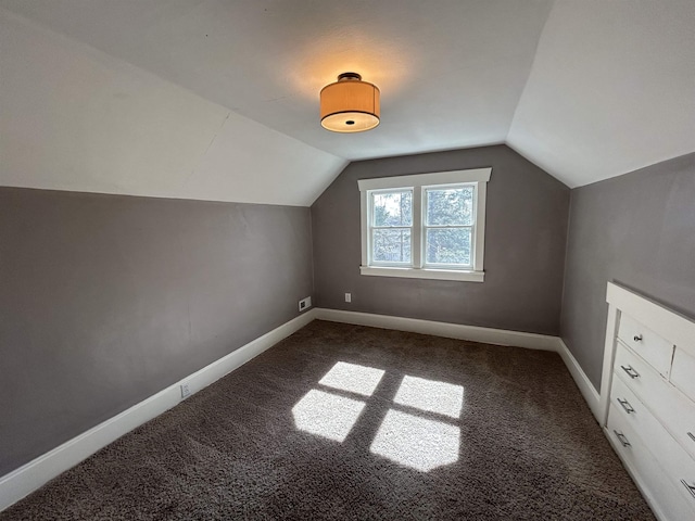 bonus room featuring carpet, lofted ceiling, and baseboards