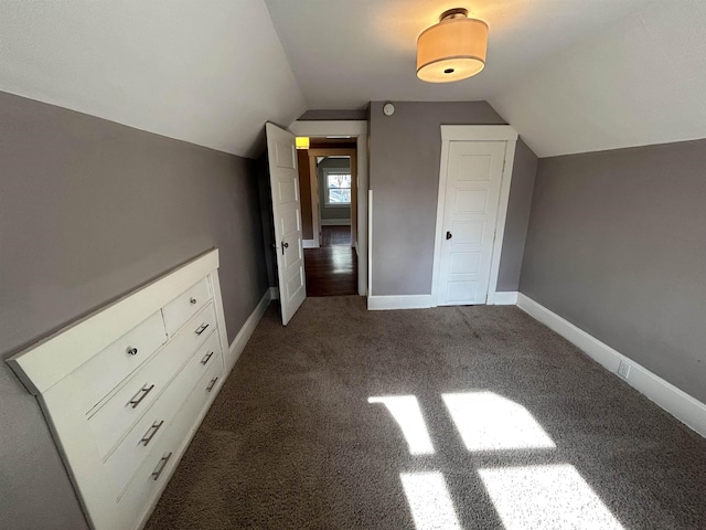 bonus room featuring baseboards, carpet floors, and lofted ceiling