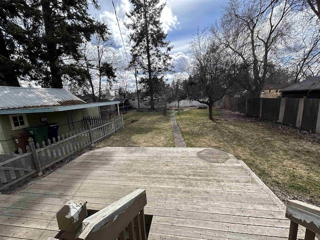 deck with a yard and a fenced backyard