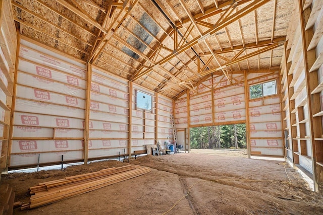 miscellaneous room featuring high vaulted ceiling