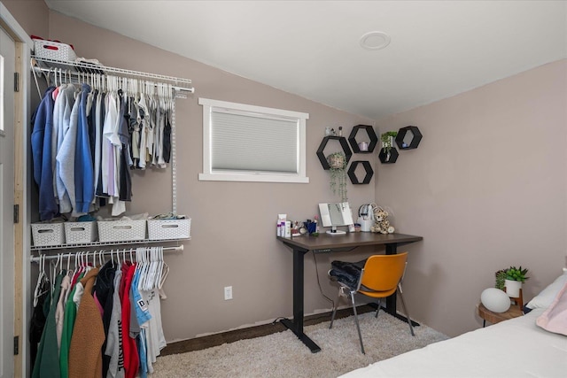 carpeted bedroom featuring lofted ceiling