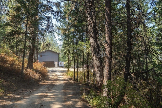 exterior space featuring an outdoor structure and driveway