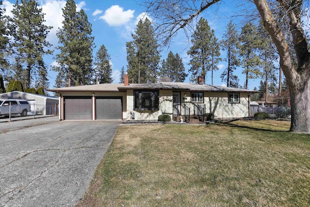 view of front of property with a front lawn, concrete driveway, a garage, and fence