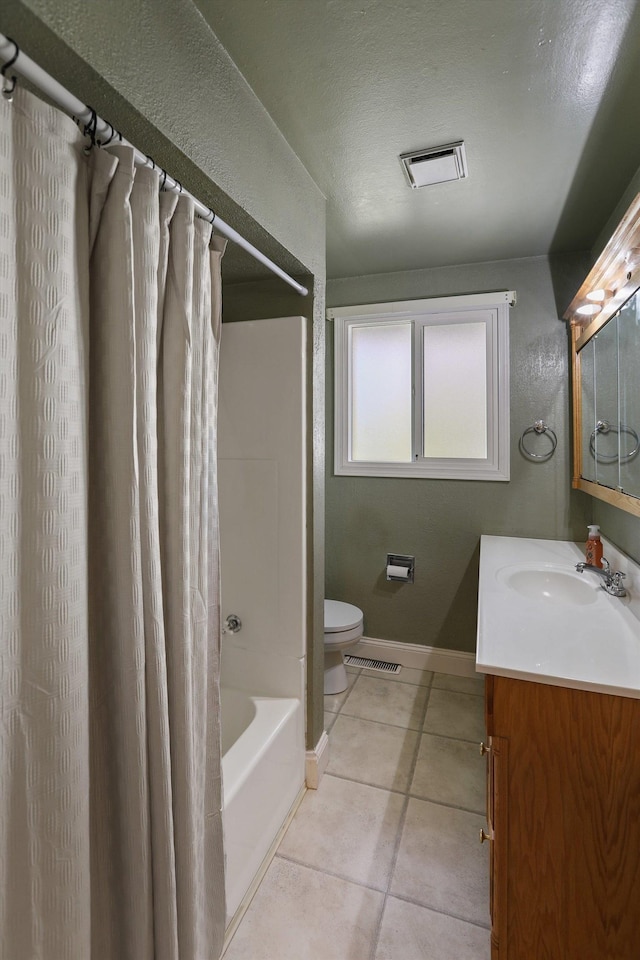 bathroom with visible vents, toilet, vanity, and tile patterned flooring