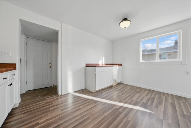 unfurnished dining area with wood finished floors