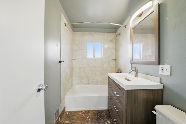 full bath with visible vents, vanity, toilet, and shower / tub combination