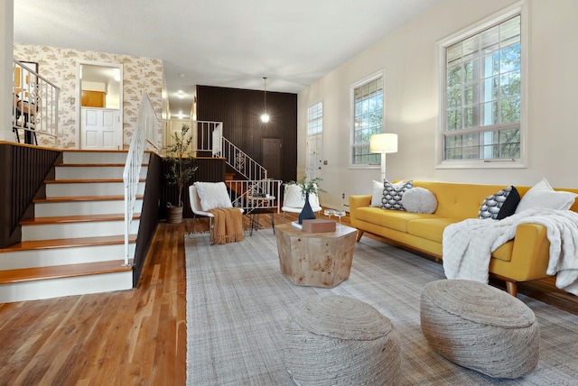 living room featuring stairs and wood finished floors