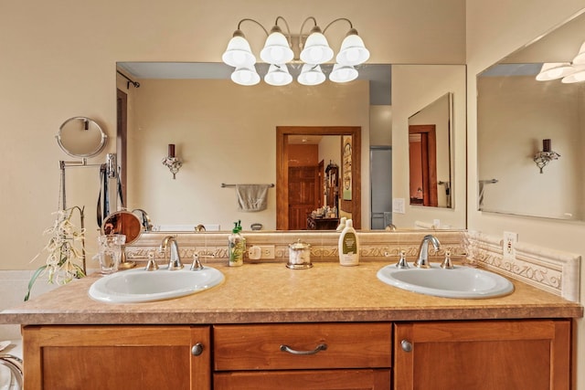 bathroom featuring a sink and double vanity