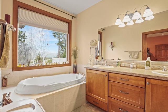 full bathroom with a garden tub, double vanity, and a sink