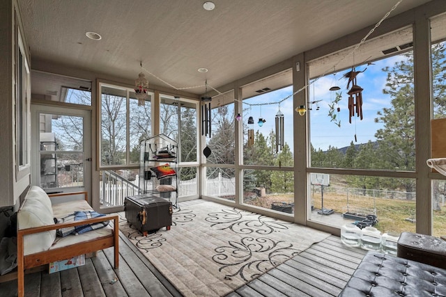 sunroom / solarium featuring a healthy amount of sunlight