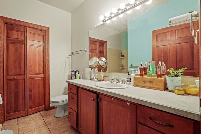 full bath with vanity, tile patterned floors, and toilet