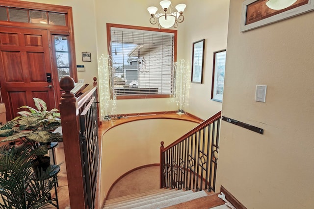 entrance foyer featuring a chandelier and stairway