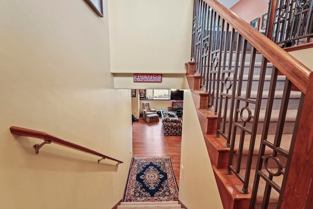 staircase with wood finished floors