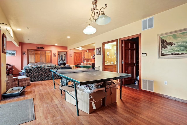 game room featuring recessed lighting, baseboards, visible vents, and light wood finished floors