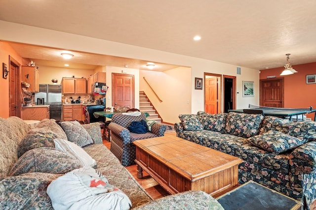 living area featuring visible vents, stairway, recessed lighting, wood finished floors, and billiards