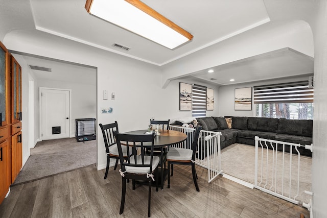 dining area with recessed lighting, visible vents, baseboards, and wood finished floors