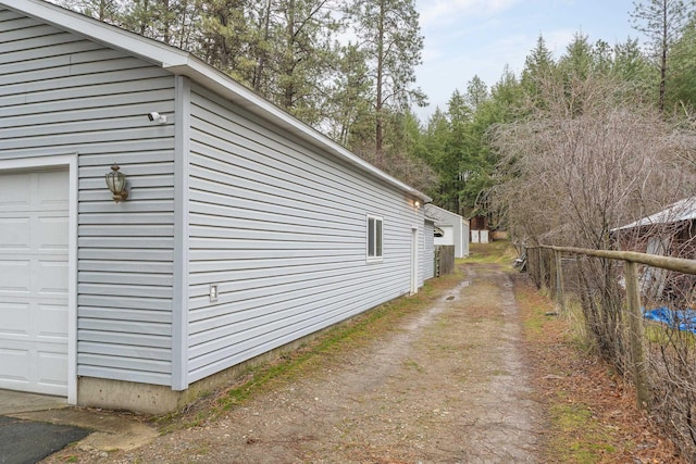 view of side of home with a garage