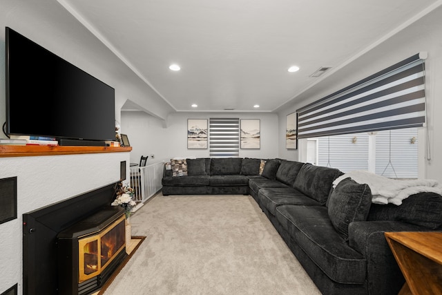 living room with recessed lighting, visible vents, and carpet