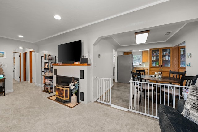 dining area with recessed lighting, light colored carpet, visible vents, and ornamental molding