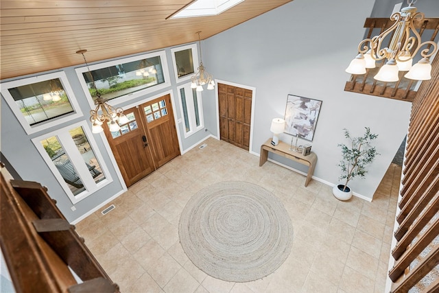 entryway with visible vents, high vaulted ceiling, an inviting chandelier, baseboards, and wood ceiling