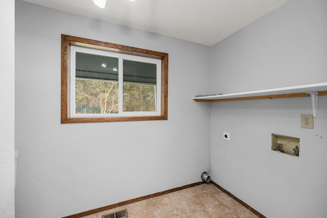 laundry area featuring visible vents, baseboards, laundry area, hookup for a washing machine, and hookup for an electric dryer