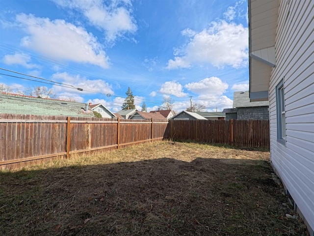 view of yard with a fenced backyard