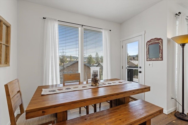 dining area with wood finished floors