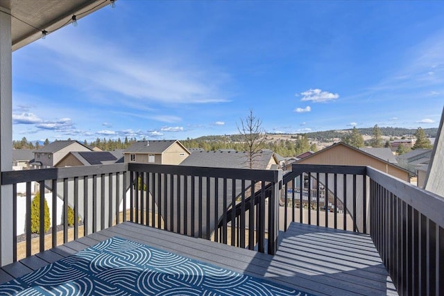 wooden deck with a residential view