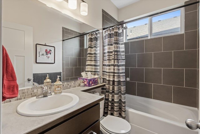 full bathroom with tasteful backsplash, shower / bath combo, vanity, and toilet