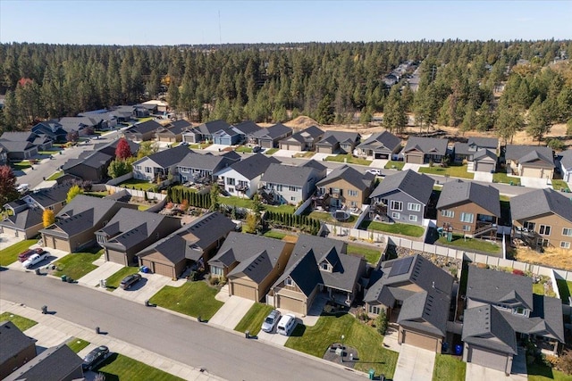 bird's eye view with a residential view and a wooded view