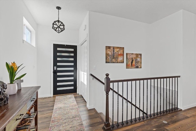 entrance foyer with wood finished floors and baseboards