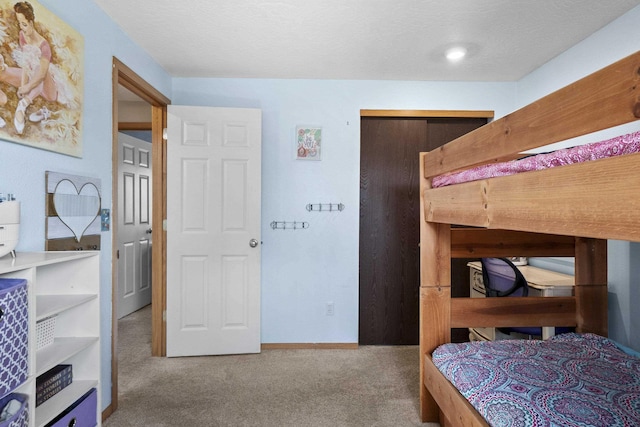 bedroom with baseboards and carpet flooring